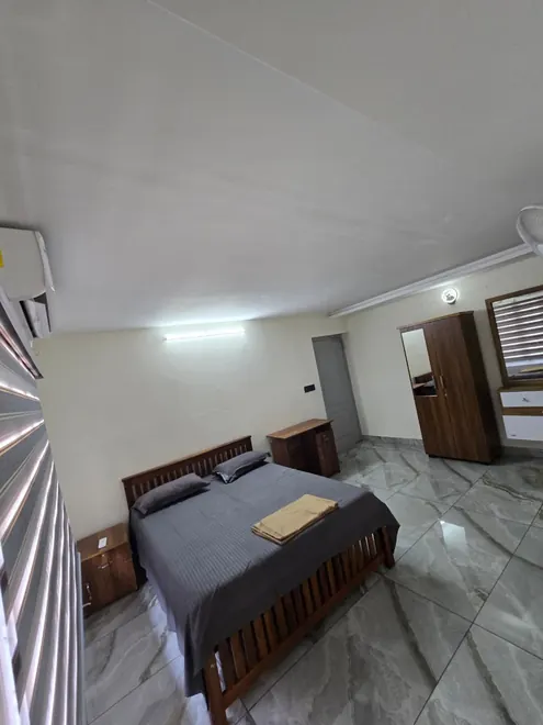 Bedroom at Grey Oasis showing a double bed and wardrobe
