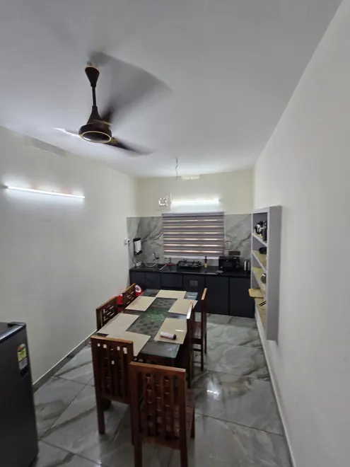 Dining table and seating at Grey Oasis Homestay in Thrissur