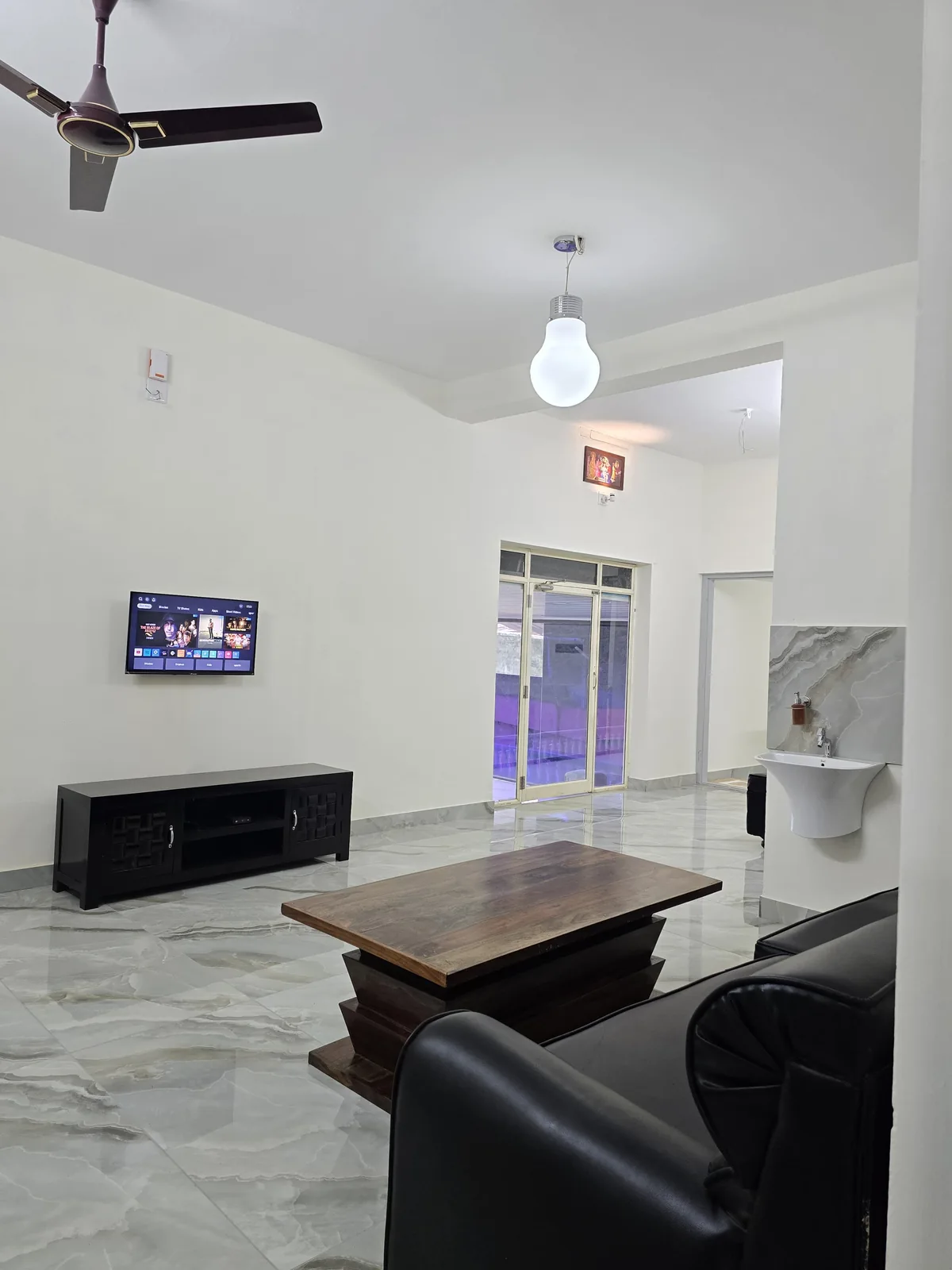 Grey Oasis living room with sofas, television and coffee table