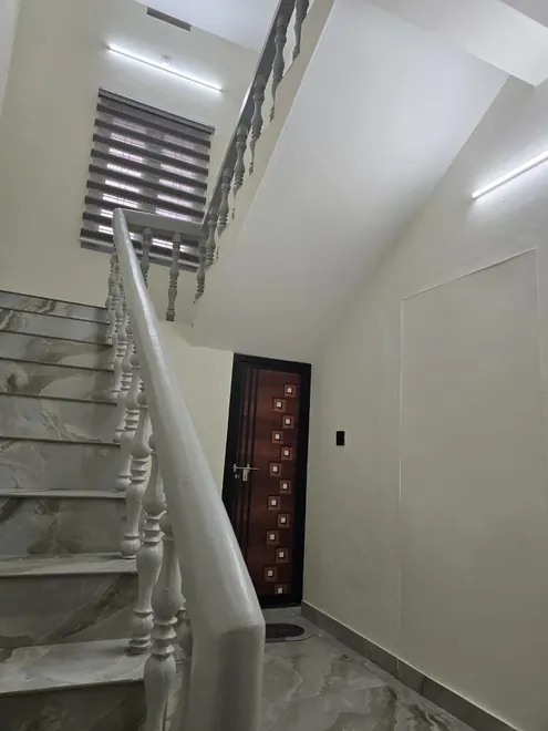 Staircase providing access to the Grey Oasis upstairs homestay