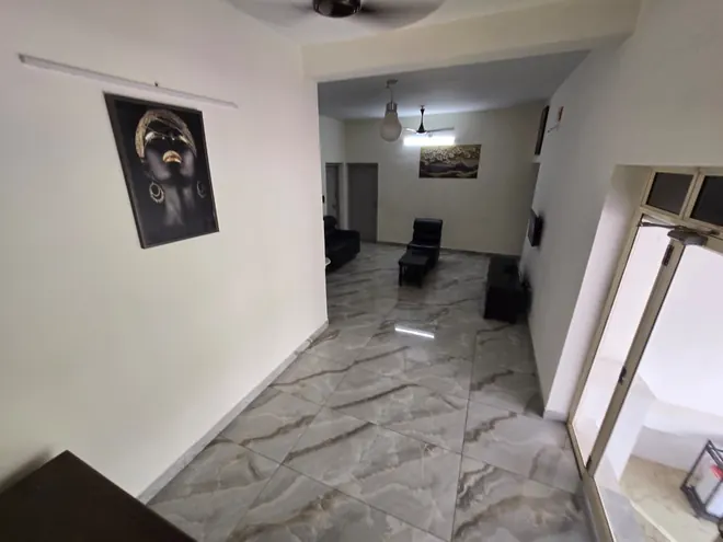 Interior hallway and living space in the private upstairs accommodation at Grey Oasis